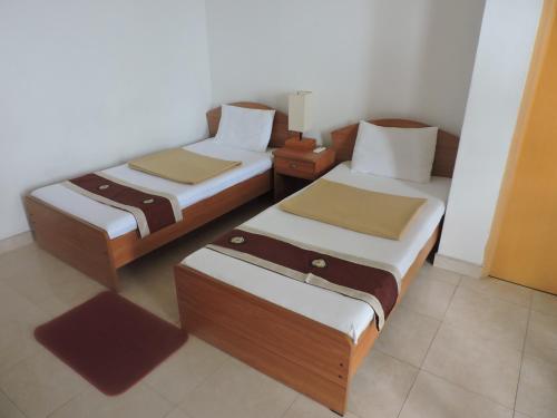 Postel nebo postele na pokoji v ubytování Villa Hotel