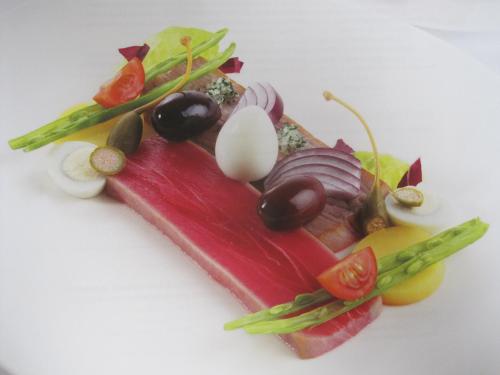 a close up of a plate of food with vegetables at City-Hotel Ochsen in Zug