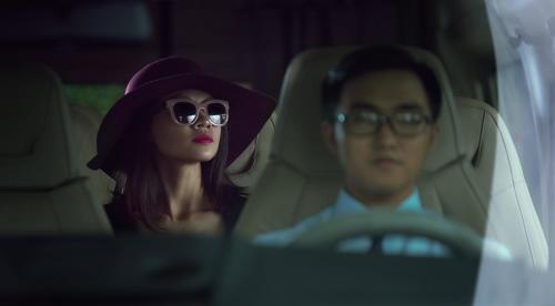 a man and a woman sitting in a car at Ibis Saigon Airport in Ho Chi Minh City