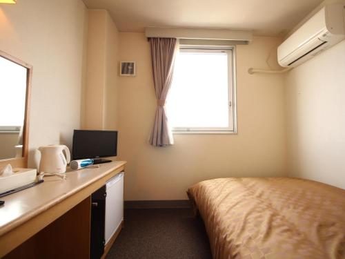 Televízia a/alebo spoločenská miestnosť v ubytovaní Hotel LC Gifu Hashima
