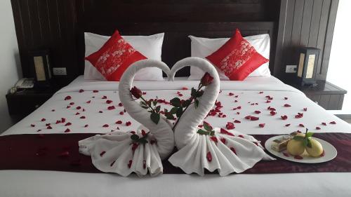 two swans made to look like hearts on a bed at Patong Princess in Patong Beach