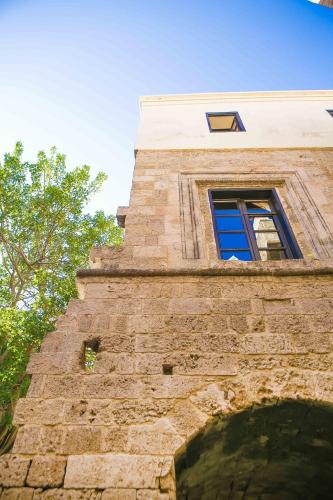 a building with a window on the side of it at Medieval Dreams Villa in Rhodes Town