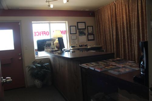 an office with a reception desk in a hotel room at The Lake House Inn in Laurie