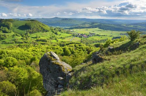 a rock on a hill with a view of a valley at Landhaushotel Hof Wasserkuppe in Poppenhausen