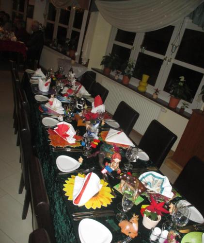 a long table with plates and glasses on it at Adler Golf-& Tagungshotel in Harth - Pöllnitz