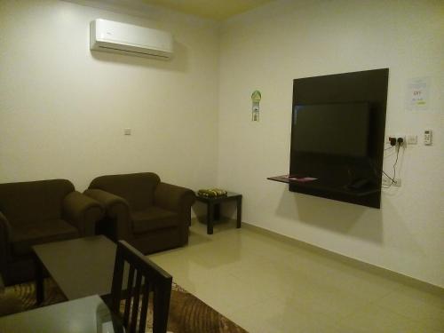 Televízia a/alebo spoločenská miestnosť v ubytovaní Avene For Furnished Residential Units