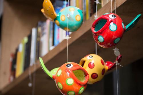 a group of ornaments are hanging from a shelf at Marcel de Buenos Aires in Buenos Aires