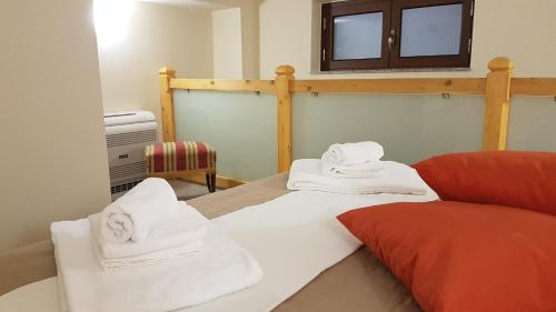 Postel nebo postele na pokoji v ubytování Loft al Vicoletto sul Mare