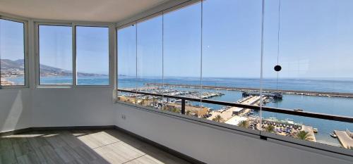 Las Palmeras - Seafront Apartment for 6 with Glazed Terrace and Marina Views