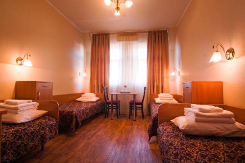 Postel nebo postele na pokoji v ubytování Mini-hotel on Geroiv Energetykiv Street 18
