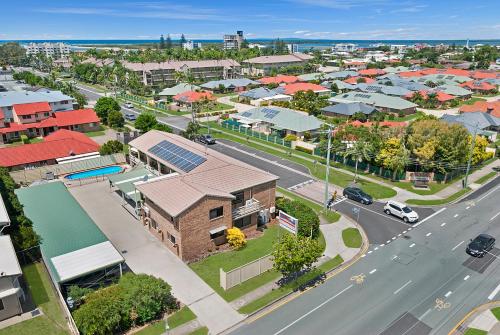 an aerial view of a town with a street at Golden Beach Motor Inn in Caloundra