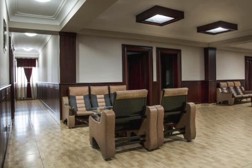 a waiting room with chairs in a building at King Hotel in Peje