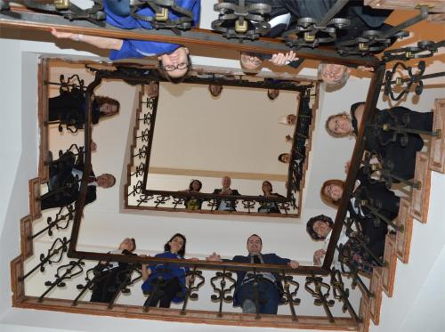 a group of people sitting in front of a mirror at Astoria Hotel Italia in Udine