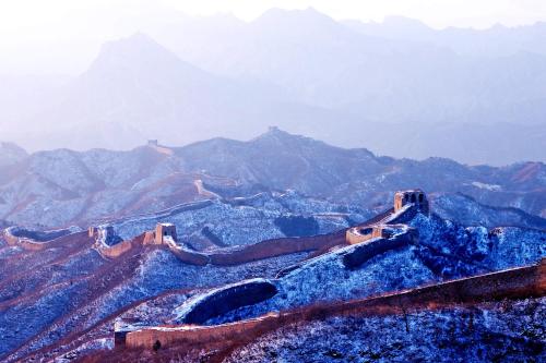 a view of the great wall of china with mountains in the background at The Great Wall Box House - Beijing in Miyun