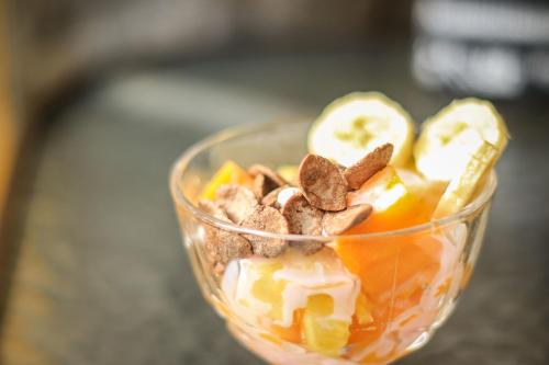 a cup of dessert with nuts and fruit at Rumi Wasi in Chivay