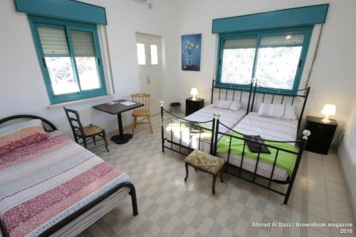 Postel nebo postele na pokoji v ubytování Auberg-Inn Guesthouse