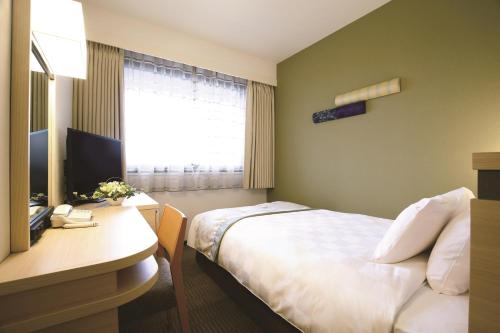 TV a/nebo společenská místnost v ubytování Karasuma Kyoto Hotel