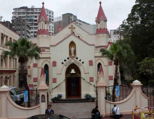a church with people sitting in front of it at Unique Hostel in Hong Kong