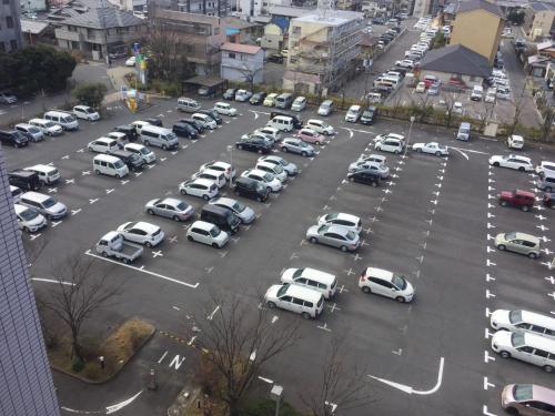an aerial view of a parking lot filled with cars at Hotel 21 in Kusatsu