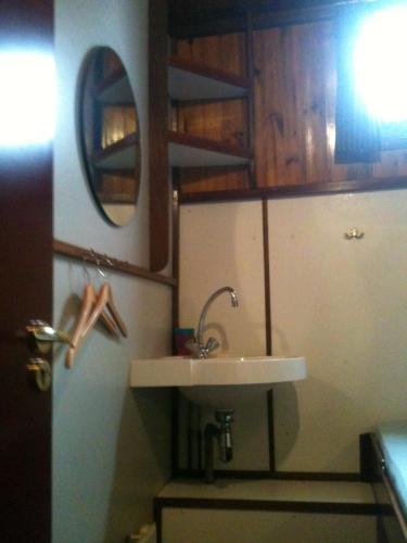 a bathroom with a sink and a mirror at MPS Waterland Amsterdam in Amsterdam