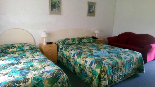 Łóżko lub łóżka w pokoju w obiekcie The Nambucca Motel