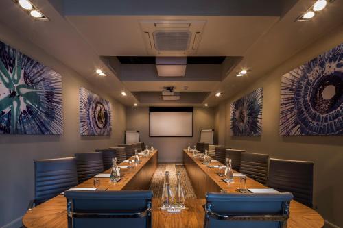 a large conference room with a long table and chairs at The Killeshin Hotel Portlaoise in Portlaoise