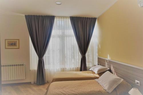 Letto o letti in una camera di B&B I Tetti di Siena