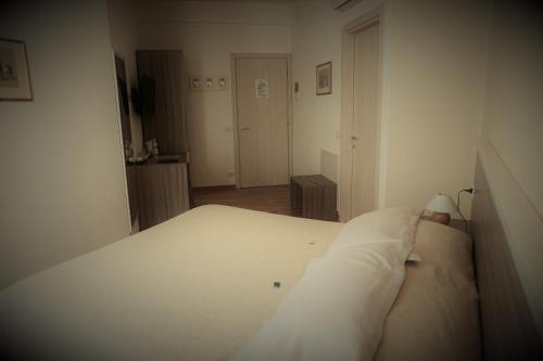 Letto o letti in una camera di B&B I Tetti di Siena