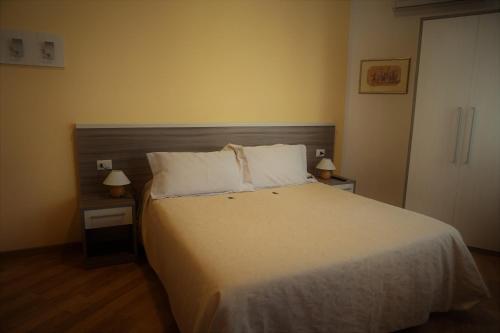 Letto o letti in una camera di B&B I Tetti di Siena