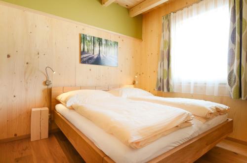Un pat sau paturi într-o cameră la Schörghof