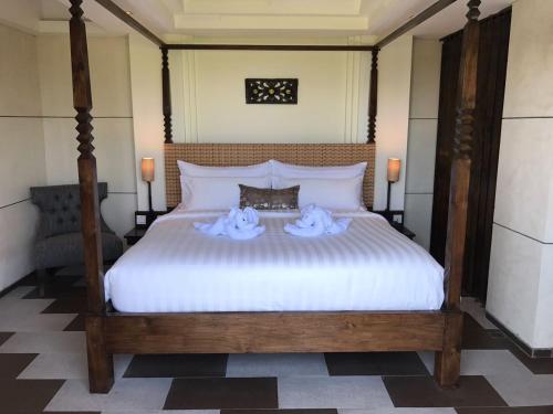 Postel nebo postele na pokoji v ubytování Anshel Hotel Seminyak
