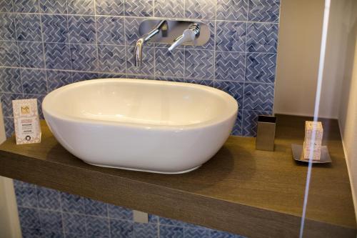 a white bowl sink on a counter in a bathroom at MelRose Relais in Massa Lubrense