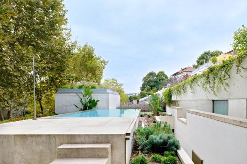 Calm Garden Residence with Pool by Reframe