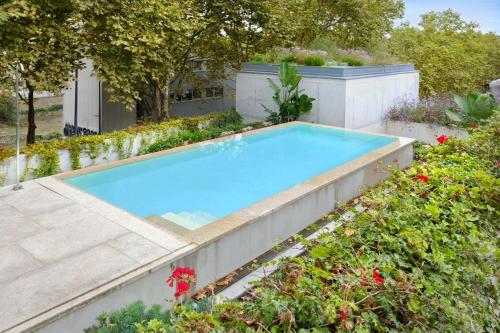Calm Garden Residence with Pool by Reframe