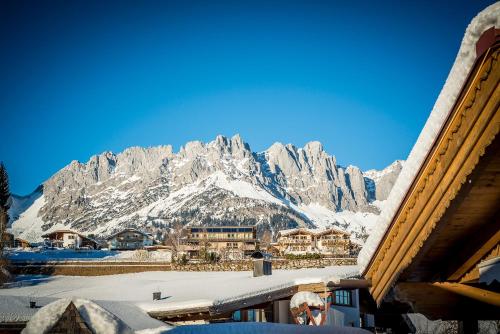 a view of a mountain with snow on it at Vitalhotel Sonnenhof in Going