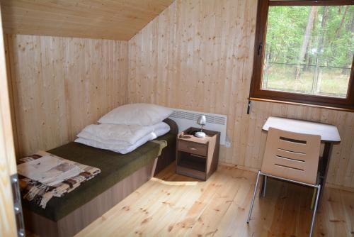 En eller flere senge i et værelse på OTW Płotki
