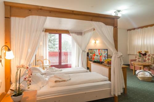 Postel nebo postele na pokoji v ubytování Hotel Hellweger