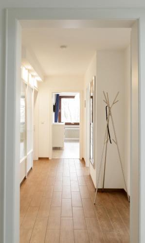 a hallway with a windmill in the middle of a room at Dünenhaus Steinmarne in Cuxhaven