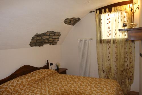 Postel nebo postele na pokoji v ubytování Maison Cassius