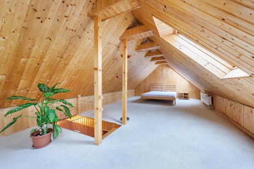 an attic room with a staircase and a bench at Marie - Luisa in Prague