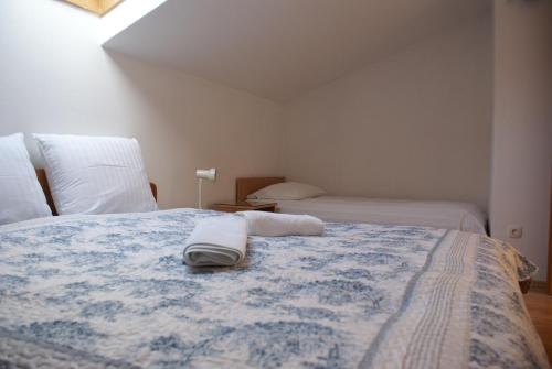 Ένα ή περισσότερα κρεβάτια σε δωμάτιο στο Apartments Robert
