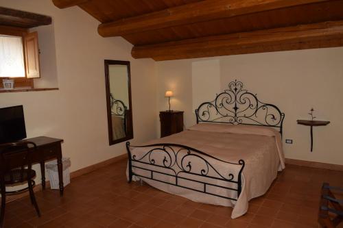 Ένα ή περισσότερα κρεβάτια σε δωμάτιο στο Albergo Diffuso La Piana dei Mulini
