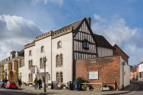 a building on the corner of a street at The Stratford Townhouse in Stratford-upon-Avon