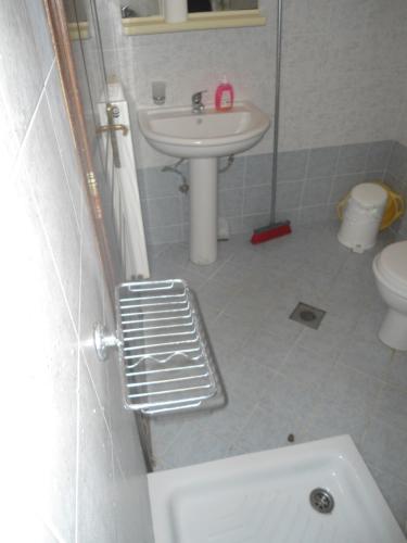 a bathroom with a sink and a toilet at Vergina in Skala Potamias