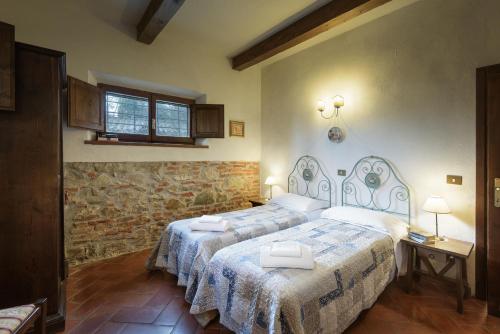 Кровать или кровати в номере Romitorio di Castiglione del Lago