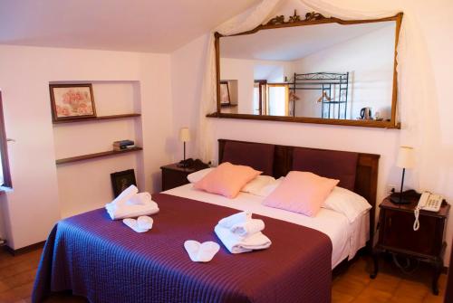 Postel nebo postele na pokoji v ubytování Boutique Hotel Corte Malaspina