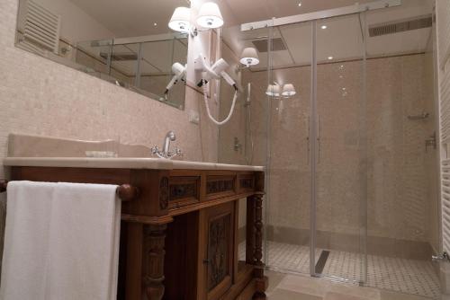 a bathroom with a sink and a shower at Masseria Salamina in Fasano