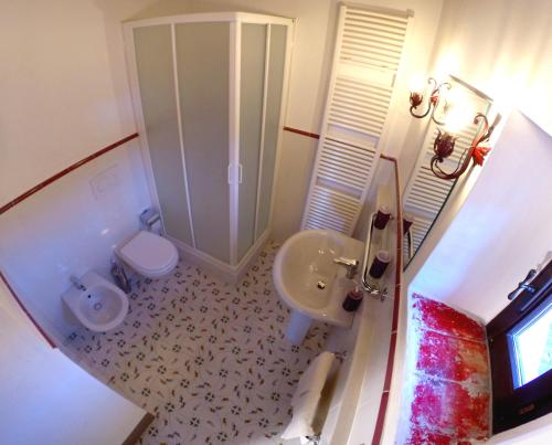 an overhead view of a bathroom with a shower and a sink at Candido Apartment in Vagliagli