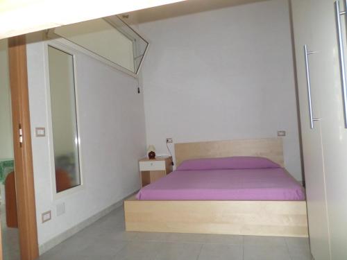 Ένα ή περισσότερα κρεβάτια σε δωμάτιο στο Residence Dolce Far Niente