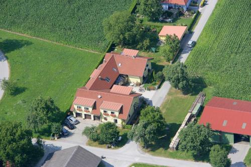 an overhead view of a large house with red roofs at Privatzimmer und Ferienwohnungen Leeb in Persenbeug-Gottsdorf